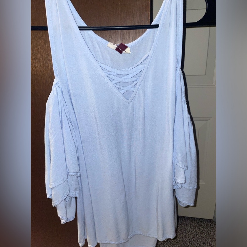Silky light blue off the shoulder shirt. Short sleeved